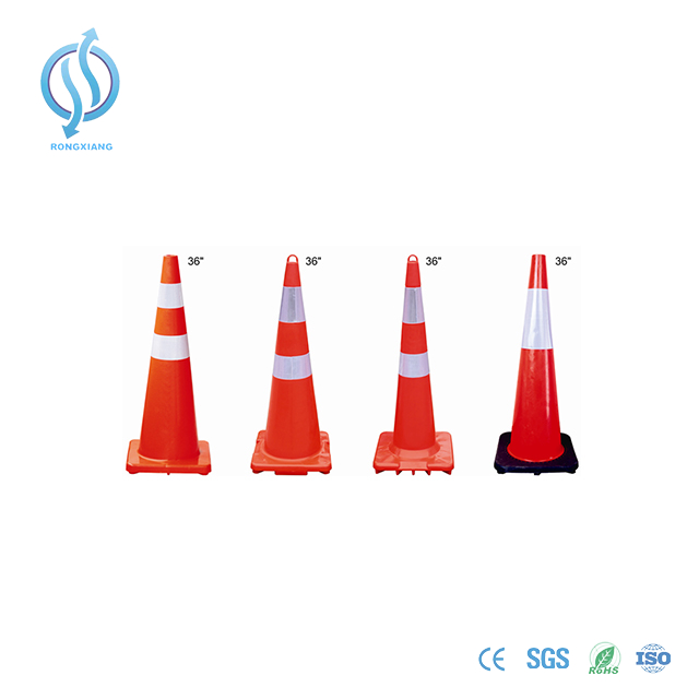 Reflective orange traffic cone on road